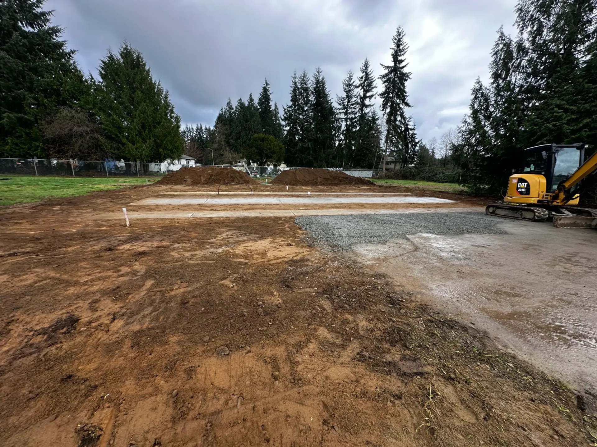 manufactured-home-cured-concrete-pad-site-prep-excavator