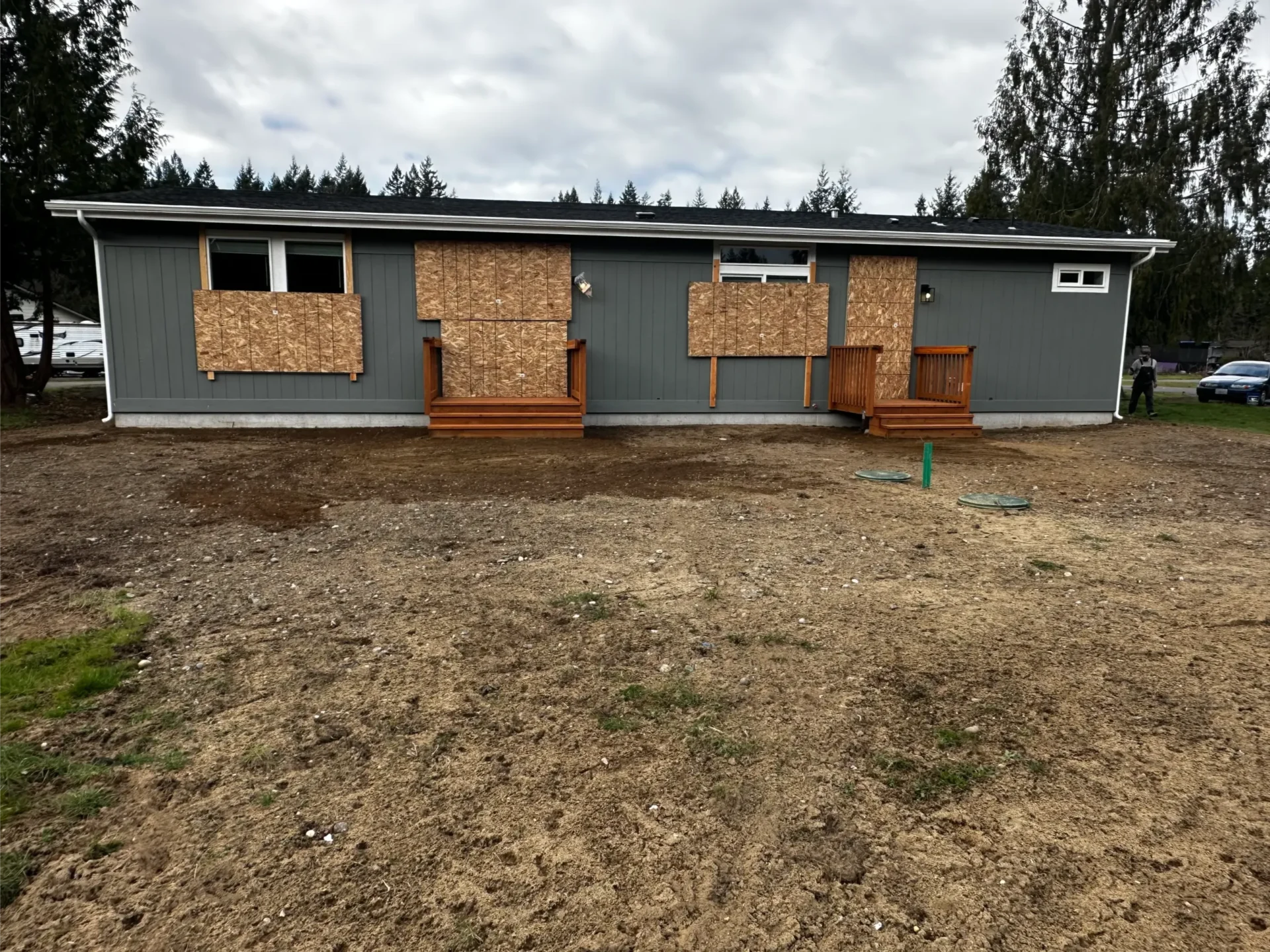 manufactured-home-rear-elevation-cedar-decks-septic-risers